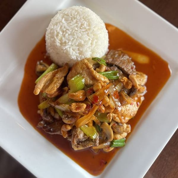 Thai Time's stir-fried chicken and vegetables with mushrooms and onions, served with white rice.